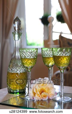 Blossom, glasses and carafe on table View Large Photo Image Stock Photo - Blossom, glasses and carafe on table. Fotosearch