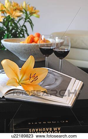 Book, flower, red wine glasses and fruit bowl on table View Large Photo Image Stock Image - Book, flower, red wine glasses and fruit bowl on table. Fotosearch