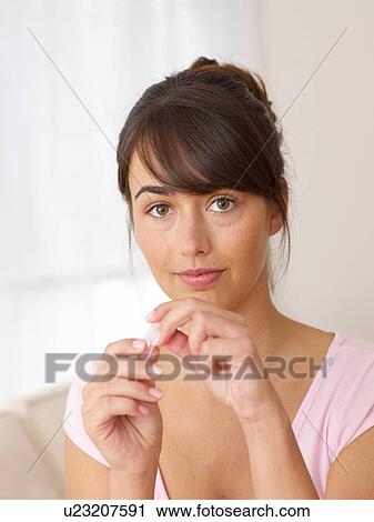 Stock Image - Brunette young woman. Fotosearch