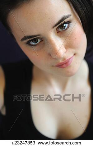 Stock Image - Brunette young woman. Fotosearch