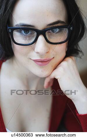 Brunette young woman with glasses smiling View Large Photo Image Stock Image - Brunette young woman with glasses smiling. Fotosearch