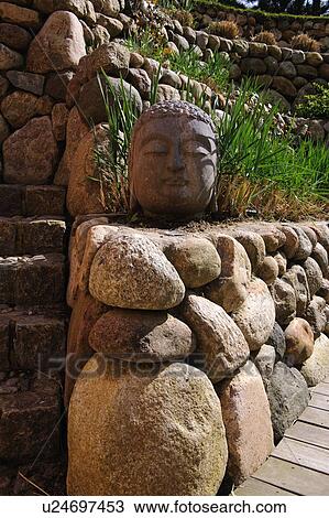 Buddha statue made of stone in garden View Large Photo Image Stock Image - Buddha statue made of stone in garden. Fotosearch