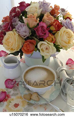 Bunch of flowers and coffee set on dining table View Large Photo Image Stock Photograph - Bunch of flowers and coffee set on dining table. Fotosearch