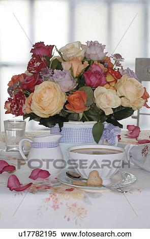 Bunch of flowers and coffee set on dining table View Large Photo Image Stock Photography - Bunch of flowers and coffee set on dining table. Fotosearch