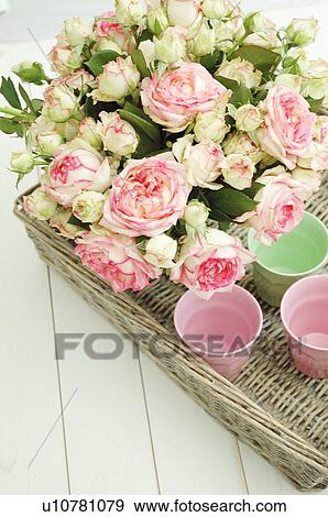 Stock Photo - Bunch of flowers and cups on tray. Fotosearch
