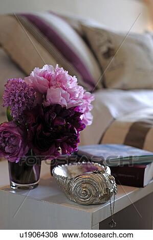 Stock Photo - Bunch of flowers and decorative seashell. Fotosearch