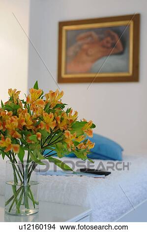 Bunch of flowers and painting on the wall View Large Photo Image Picture - Bunch of flowers and painting on the wall. Fotosearch