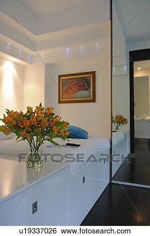 Bunch of flowers and painting on the wall View Large Photo Image Stock Photograph - Bunch of flowers and painting on the wall. Fotosearch