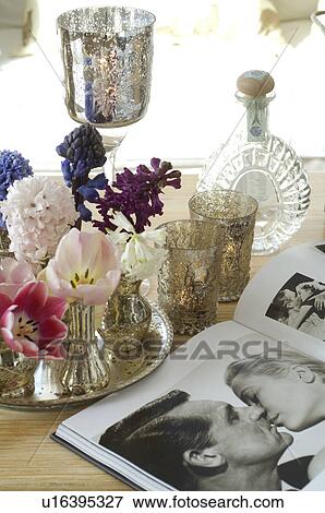 Bunch of flowers, coffee table book and glasses on table View Large Photo Image Stock Photo - Bunch of flowers, coffee table book and glasses on table. Fotosearch
