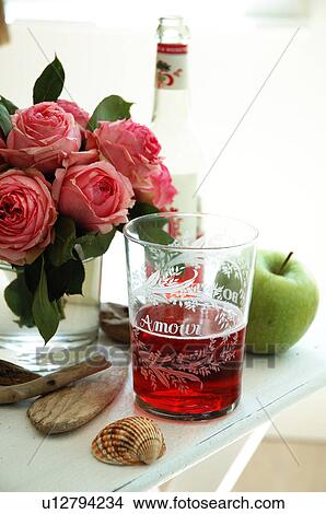 Picture - Bunch of roses, beverage and apple. Fotosearch