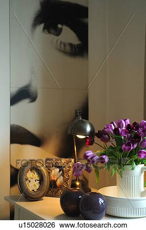 Bunch of tulips and table lamp on dresser View Large Photo Image Stock Photograph - Bunch of tulips and table lamp on dresser. Fotosearch