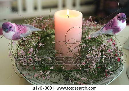 Burning candle and bird figurines View Large Photo Image Stock Image - Burning candle and bird figurines. Fotosearch