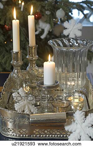 Stock Image - Burning candles and Christmas decoration. Fotosearch