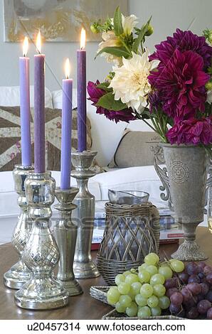 Burning candles, bunch of flowers and grapes View Large Photo Image Picture - Burning candles, bunch of flowers and grapes. Fotosearch