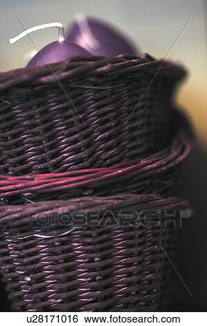 Stock Photograph - Candles in wicker basket. Fotosearch