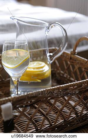 Carafe and glass of water with slice of lemon View Large Photo Image Stock Photo - Carafe and glass of water with slice of lemon. Fotosearch