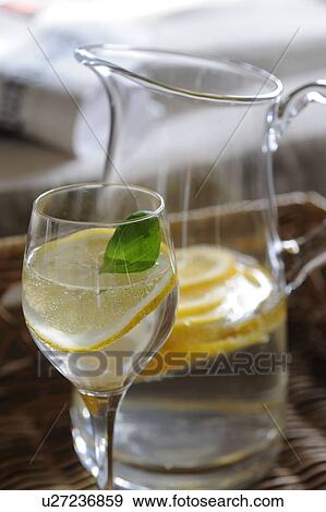 Carafe and glass of water with slice of lemon View Large Photo Image Stock Photo - Carafe and glass of water with slice of lemon. Fotosearch