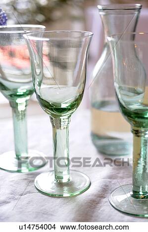 Carafe with water and drinking glasses View Large Photo Image Picture - Carafe with water and drinking glasses. Fotosearch
