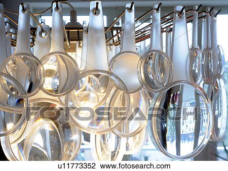 Ceiling lamp made of magnifying glasses View Large Photo Image Stock Image - Ceiling lamp made of magnifying glasses. Fotosearch