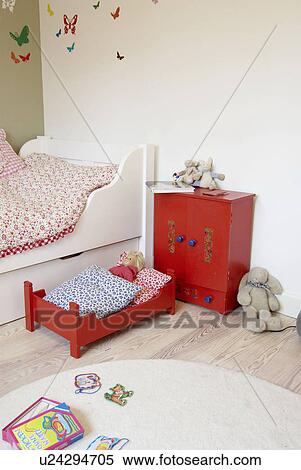 Stock Photography - Childrens room with dolls bed. Fotosearch