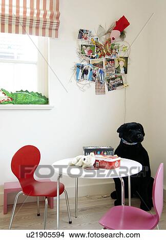 Childrens room with sitting area and cuddly dog View Large Photo Image Picture - Childrens room with sitting area and cuddly dog. Fotosearch