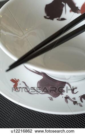 Stock Image - Chopsticks and bowl. Fotosearch