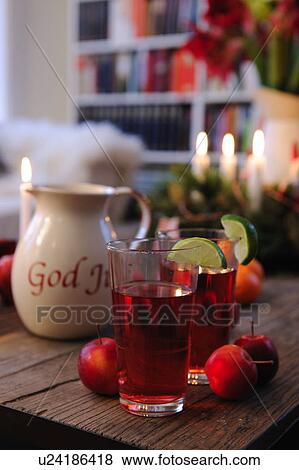 Stock Photo - Christmas beverage and Advent wreath on wooden table. Fotosearch