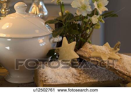 Stock Image - Christmas biscuits, flower and soup tureen. Fotosearch