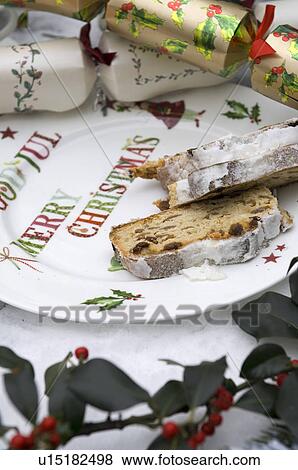 Christmas crackers and Stollen on plate View Large Photo Image Stock Photo - Christmas crackers and Stollen on plate. Fotosearch