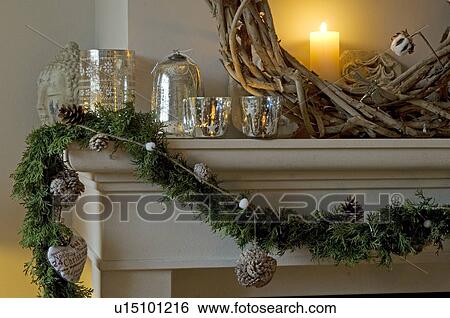 Stock Photograph - Christmas decoration on mantelpiece. Fotosearch