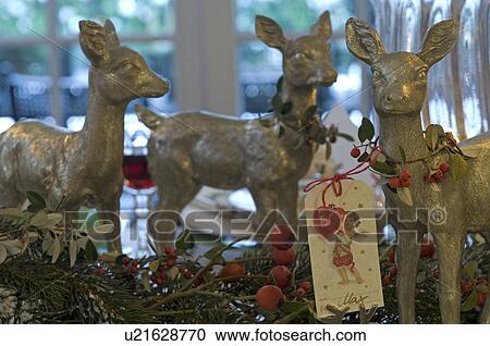 Stock Image - Christmas decoration with deer figurines. Fotosearch