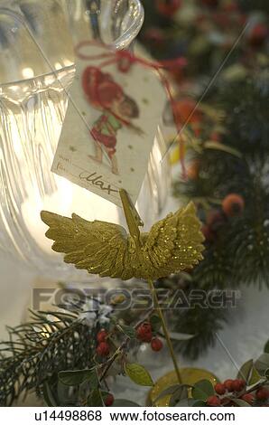 Christmas decoration with twig, candle and gift tag View Large Photo Image Stock Photo - Christmas decoration with twig, candle and gift tag. Fotosearch