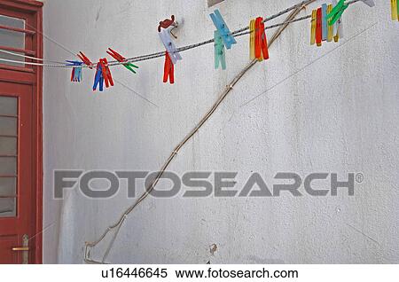 Stock Photography - Clothesline with clothes pegs. Fotosearch