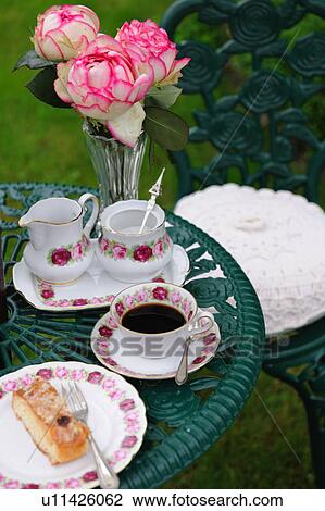Coffee and cake on garden table View Large Photo Image Stock Image - Coffee and cake on garden table. Fotosearch