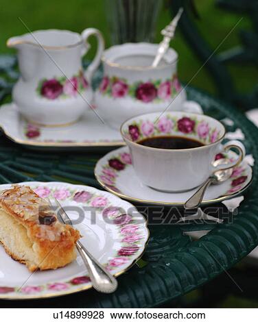 Coffee and cake on garden table View Large Photo Image Stock Photo - Coffee and cake on garden table. Fotosearch