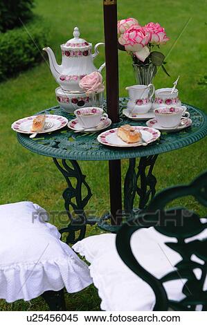 Coffee set and bunch of flowers on garden table View Large Photo Image Stock Photography - Coffee set and bunch of flowers on garden table. Fotosearch