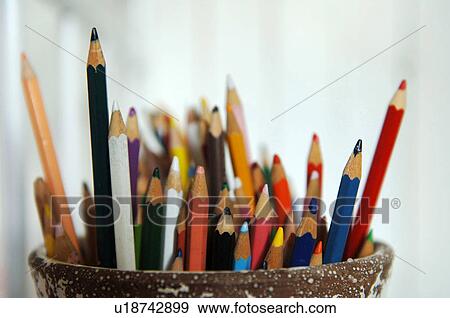Stock Photo - Color pencils in pen holder. Fotosearch