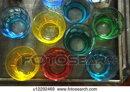 Stock Photo - Colored glasses on tray. Fotosearch