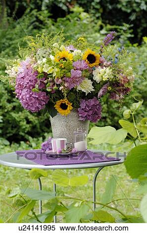 Colorful bunch of flowers on garden table View Large Photo Image Stock Photography - Colorful bunch of flowers on garden table. Fotosearch
