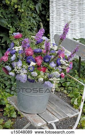 Stock Photo - Colorful bunch of flowers with Aster. Fotosearch
