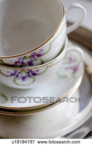 Stock Photo - Cups with floral pattern und saucers. Fotosearch