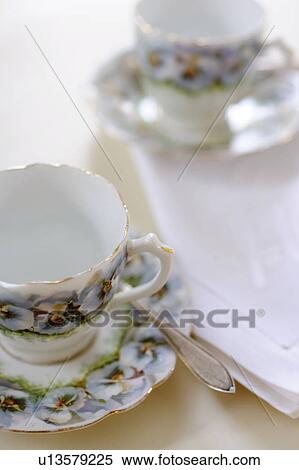 Stock Photography - Cups with floral pattern und saucers. Fotosearch