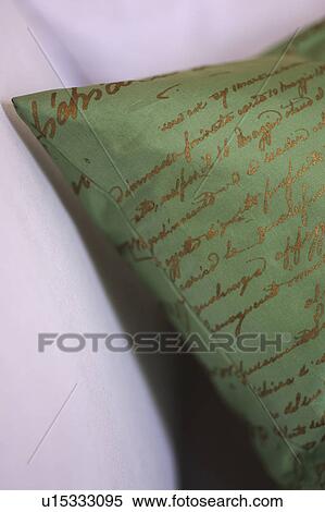 Cushion with ornate scripture View Large Photo Image Stock Photography - Cushion with ornate scripture. Fotosearch