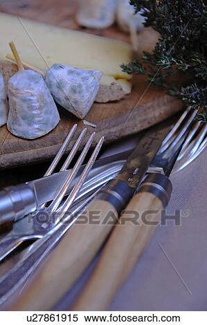 Stock Photography - Cutlery and cheese platter. Fotosearch