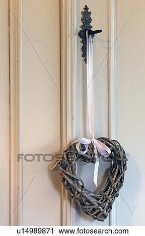 Decorative heart hanging on handle View Large Photo Image Stock Image - Decorative heart hanging on handle. Fotosearch