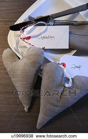 Stock Photo - Decorative hearts with name tags on plate. Fotosearch