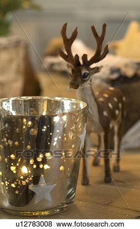 Deer figurine and windlight View Large Photo Image Stock Photo - Deer figurine and windlight. Fotosearch
