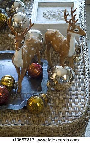 Deer figurines and Christmas baubles View Large Photo Image Stock Image - Deer figurines and Christmas baubles. Fotosearch