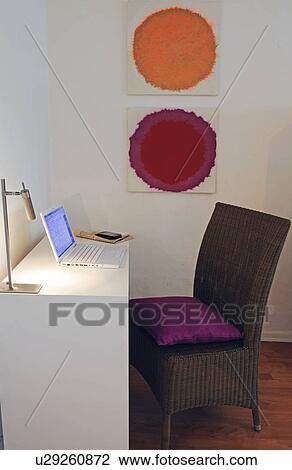 Desk with laptop and painting on the wall View Large Photo Image Stock Image - Desk with laptop and painting on the wall. Fotosearch