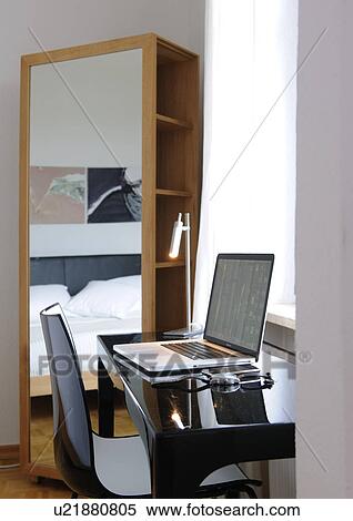 Desk with laptop at the window View Large Photo Image Stock Photography - Desk with laptop at the window. Fotosearch